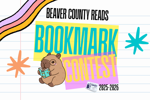 Drawing of a capybara reading a book on ruled notebook paper